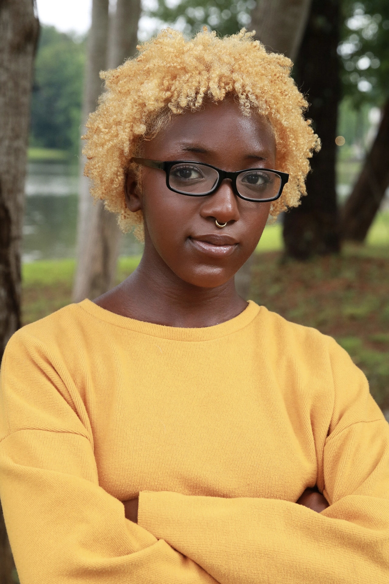 Amauriah in a yellow top outside